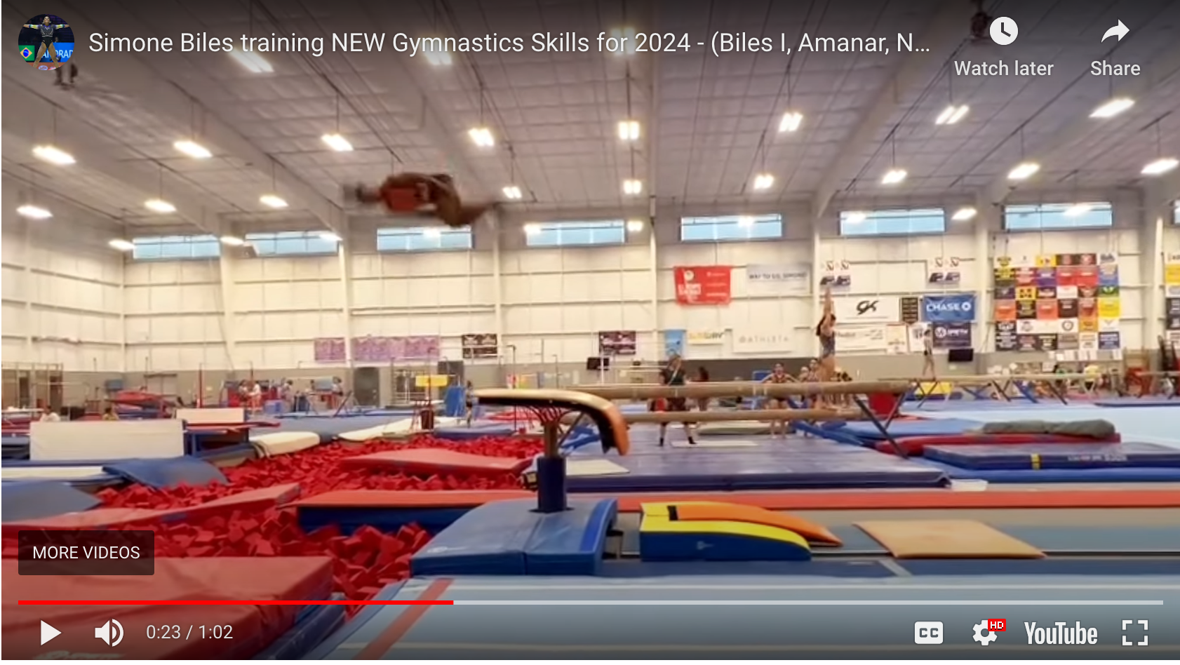 A screenshot of a YouTube video that shows Simone Biles practicing a Yurchenko double tuck.